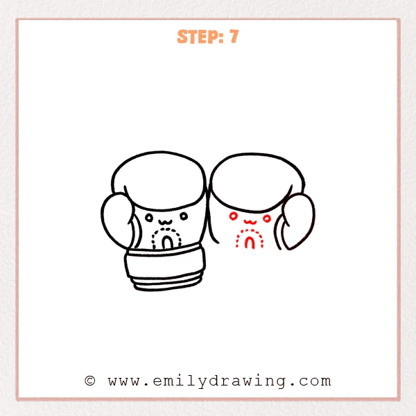 how to draw a boxing gloves - Step 7 of an easy boxing gloves drawing adding matching dot eyes, a small mouth, and a stitched patch detail on the second glove.